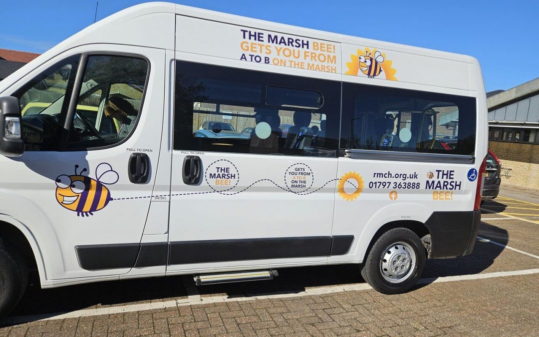 Marsh Bee transport van parked at Romney Marsh Community Hub on a bright sunny day. Side view.